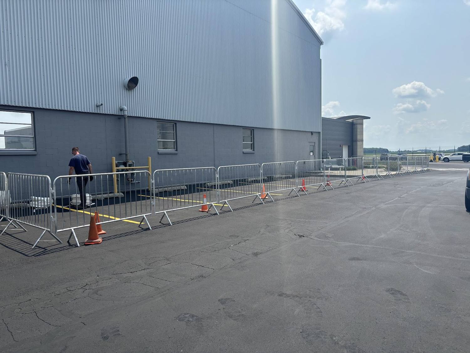 Crowd control barricades set outside a commercial building for an event