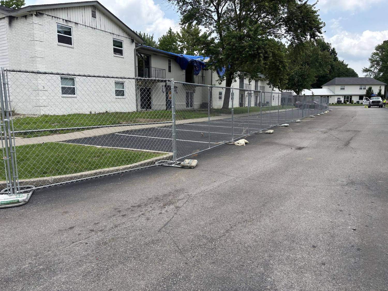 Temporary fence panels along the street frontage of a residential block